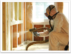 Spray foam insulation being installed in a wall.