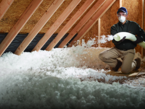Blown-in insulation being installed in an attic.