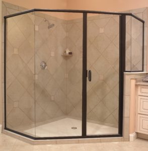 Glass-enclosed shower with black framing.